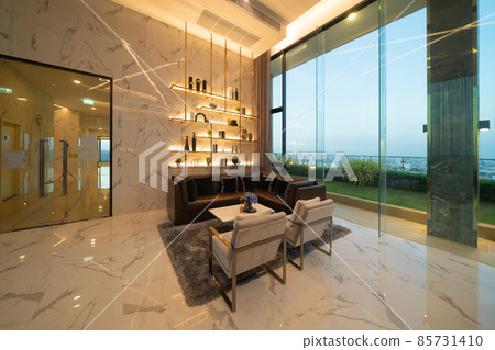 Inside of modern hotel lobby, entrance and reception, interior architecture design decoration, waiting area with urban city view of outdoor, indoor. Inside of modern hotel lobby, entrance and reception, interior architecture design decoration, waiting area with urban city view of outdoor, indoor. 85731410