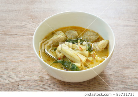 spicy boiled slice fresh coconut shoot with fish ball in green curry soup on bowl spicy boiled slice fresh coconut shoot with fish ball in green curry soup on bowl 85731735