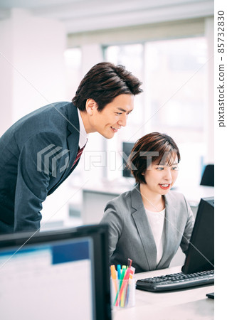 A businessman doing desk work in the office A businessman doing desk work in the office 85732830