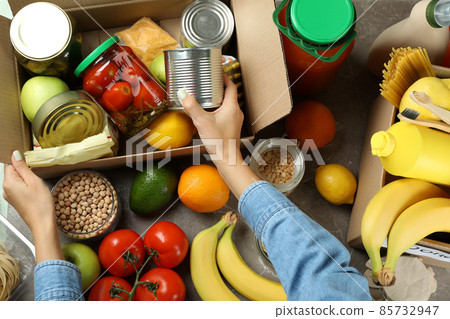 Donation concept with female hands and different food Donation concept with female hands and different food 85732947