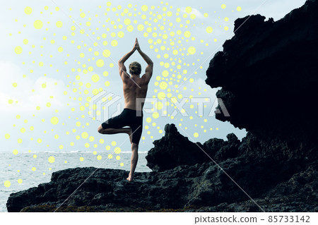 A photo of an athlete man practising yoga combined with yellow dots. A photo of an athlete man practising yoga combined with yellow dots. 85733142