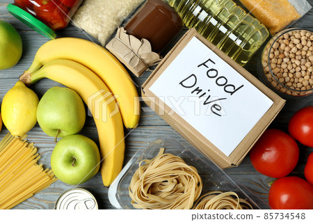 Concept of food drive with meal on wooden table 85734548