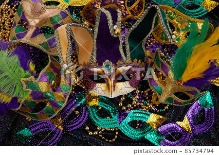 Mardi Gras Mask and colorful Mardi Gras Beads Background Mardi Gras Mask and colorful Mardi Gras Beads Background 85734794