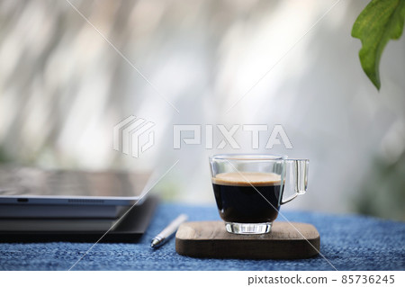 Espresso coffee cup with crema and tablet diary notebook 85736245