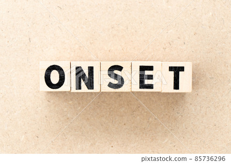 Alphabet letter block in word onset on wood background Alphabet letter block in word onset on wood background 85736296