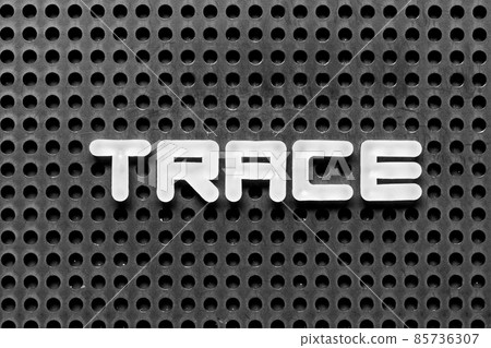 White alphabet letter in word trace on black pegboard background 85736307