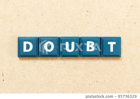 Tile alphabet letter in word doubt on wood background 85736329