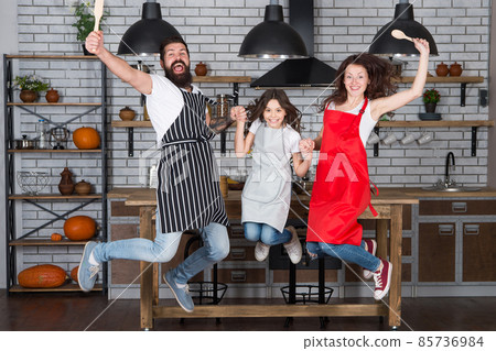 Cooking with child might be fun. Having fun in kitchen. Cooking with child might be fun. Having fun in kitchen. 85736984