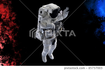 Astronaut isolated on a black background. Dust splash in space style Astronaut isolated on a black background. Dust splash in space style 85737003