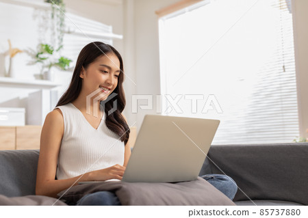 Entrepreneur beautiful business asian young woman wear casual work online with laptop at home.Freelance woman working online sale marketing,Shopping online at home.Small Business Startup concept 85737880