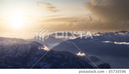 Aerial Panoramic View of Canadian Mountain covered in snow. Aerial Panoramic View of Canadian Mountain covered in snow. 85738596