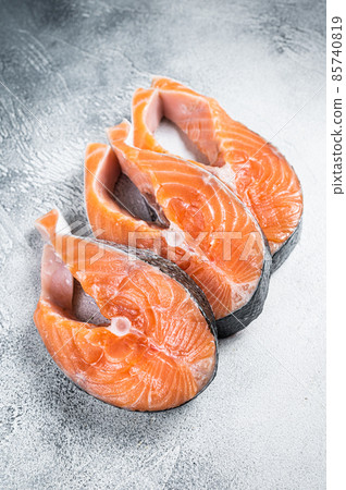 Salmon or trout steaks, raw fish prepared for cooking. White background. Top view 85740819