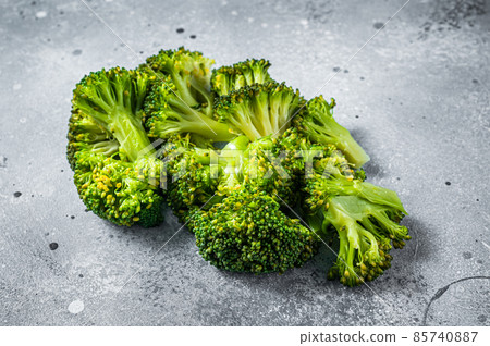 Green boiled broccoli cabbage on kitchen table. Gray background. Top view 85740887
