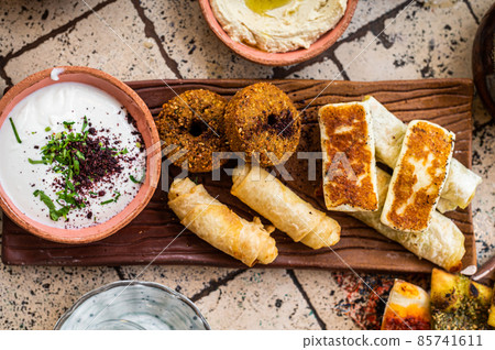 Fried cheese and falafel with sause in Turkish Village Breakfast. Top view 85741611