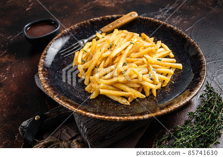 Homemade Baked Potato french fries in rustic palte with thyme. Dark background. Top view 85741630