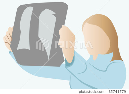 The doctor holds an Xray of the lungs in his hand. The doctor holds an Xray of the lungs in his hand. 85741779
