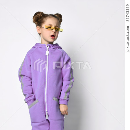little preschooler girl in a warm blue sports 85743329