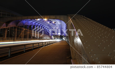 Illumination of Sakuranomiya Bridge (also known as Ginbashi) over Okawa in Osaka City, light trails of passing vehicles Illumination of Sakuranomiya Bridge (also known as Ginbashi) over Okawa in Osaka City, light trails of passing vehicles 85744804