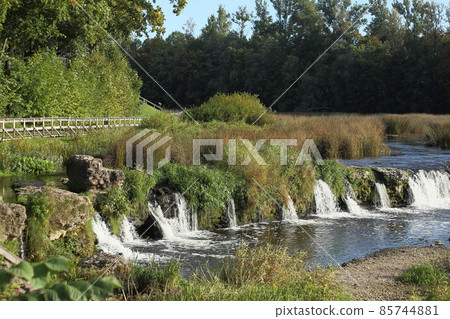 Ventas Rumba Waterfall and wooden bridges on the Venta river. Kuldiga, Latvia. High quality photo Ventas Rumba Waterfall and wooden bridges on the Venta river. Kuldiga, Latvia. High quality photo 85744881