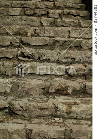 Background of gray stones. A wall of rectangular gray stones. High quality photo Background of gray stones. A wall of rectangular gray stones. High quality photo 85744883