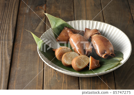 Fresh squid rice of local cuisine on bamboo leaves Fresh squid rice of local cuisine on bamboo leaves 85747275