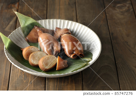 Fresh squid rice of local cuisine on bamboo leaves Fresh squid rice of local cuisine on bamboo leaves 85747276