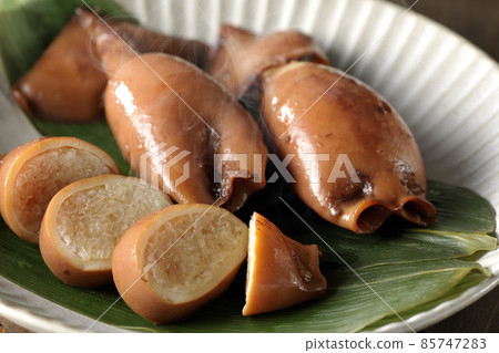 Fresh squid rice of local cuisine on bamboo leaves Fresh squid rice of local cuisine on bamboo leaves 85747283