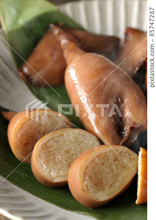 Fresh squid rice of local cuisine on bamboo leaves Fresh squid rice of local cuisine on bamboo leaves 85747287