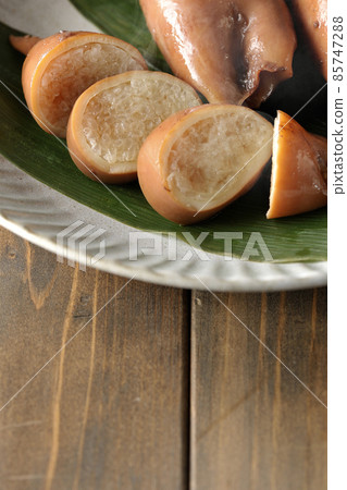 Fresh squid rice of local cuisine on bamboo leaves Fresh squid rice of local cuisine on bamboo leaves 85747288