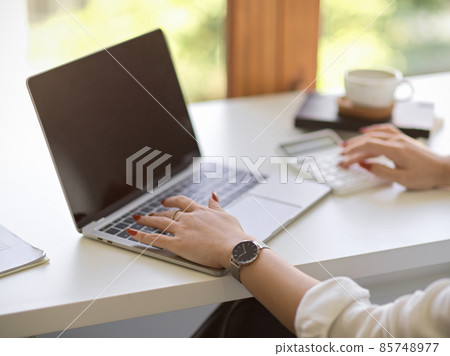 Businesswoman browsing the internet on notebook laptop computer. Businesswoman browsing the internet on notebook laptop computer. 85748977