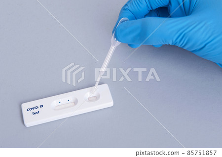 scientist or doctor hand using Rapid antigen test cassette quick fast testing identifying antibodies for COVID-19 Coronavirus is on white background 85751857