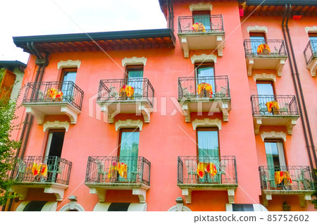 Beautiful red fasade of house at old town at Sirmione town, Italy. 85752602