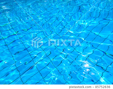 Blue pool water with sun reflections Blue pool water with sun reflections 85752636