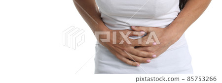 Woman with abdominal pain in white T-shirt and white background Woman with abdominal pain in white T-shirt and white background 85753266