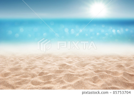 Tropical summer sandy beach focus area and bokeh sun light on blurry sea background Summer time concept background Tropical summer sandy beach focus area and bokeh sun light on blurry sea background Summer time concept background 85753704