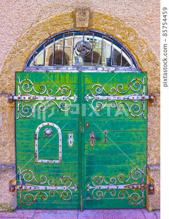 An old entrance door in Salzburg, Austria. 85754459
