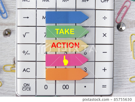 Take Action text is written on the stickers that are on the calculator 85755630