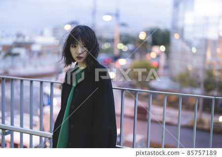 A woman wandering around the winter city A woman wandering around the winter city 85757189