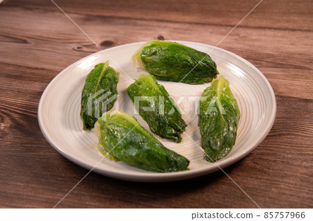 Braised lettuce recipe on a plate 85757966