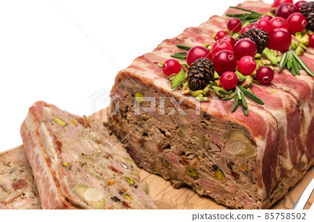 Traditional French terrine covered with bacon isolated on wooden cutting or serving board 85758502
