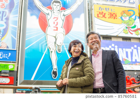 Senior Couple Trip-Winter Trip to Dotonbori, Osaka A lively tourist attraction with flashy famous signs, restaurants and theaters Senior Couple Trip-Winter Trip to Dotonbori, Osaka A lively tourist attraction with flashy famous signs, restaurants and theaters 85760581