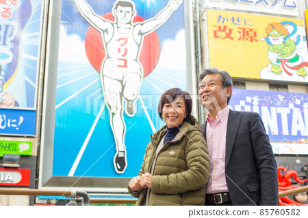 Senior Couple Trip-Winter Trip to Dotonbori, Osaka A lively tourist attraction with flashy famous signs, restaurants and theaters Senior Couple Trip-Winter Trip to Dotonbori, Osaka A lively tourist attraction with flashy famous signs, restaurants and theaters 85760582