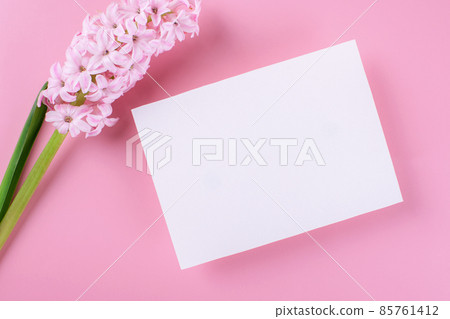 Invitation or greeting card mockup with envelope and hyacinth flowers on dark wooden background 85761412