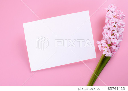 Invitation or greeting card mockup with envelope and hyacinth flowers on dark wooden background 85761413