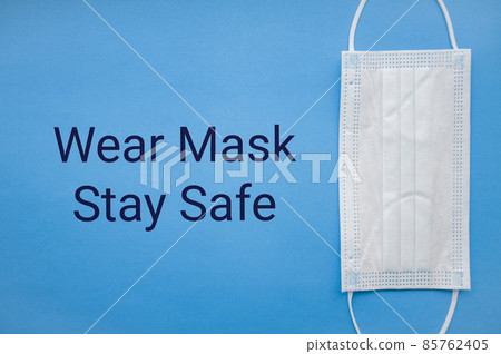 Medical mask isolated on background. Close-up of Coronavirus or COVID-19 protective face mask. Workwear prevents entry of Alpha, Beta, Gamma, Delta, Omicron into a body. Travel rules tightened over Medical mask isolated on background. Close-up of Coronavirus or COVID-19 protective face mask. Workwear prevents entry of Alpha, Beta, Gamma, Delta, Omicron into a body. Travel rules tightened over 85762405