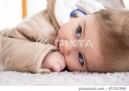 Happy baby crawling on floor or carpet Happy baby crawling on floor or carpet 85762998