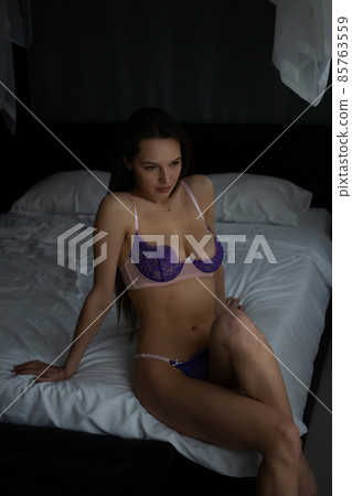 Sensual woman in underwear on bed Sensual woman in underwear on bed 85763559