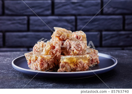 meat aspic, jellied slow cooked meat on a plate meat aspic, jellied slow cooked meat on a plate 85763740