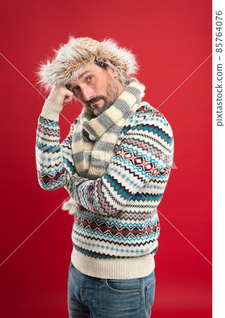Alone with thoughts. Man bearded hipster wear furry hat Alone with thoughts. Man bearded hipster wear furry hat 85764076