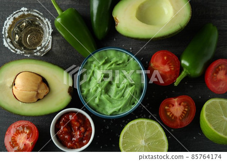 Party concept with tequila, guacamole and chips 85764174